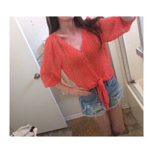 blouse in peach color ties front